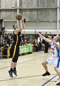 Lachie Fenwick shoots over Ali Granger Photo - Ken Davies