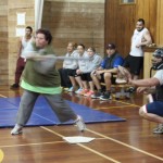 Fay Mulligan swings fast as the catcher waits.